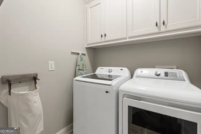 a en suite bathroom with a granite countertop sink and a mirror