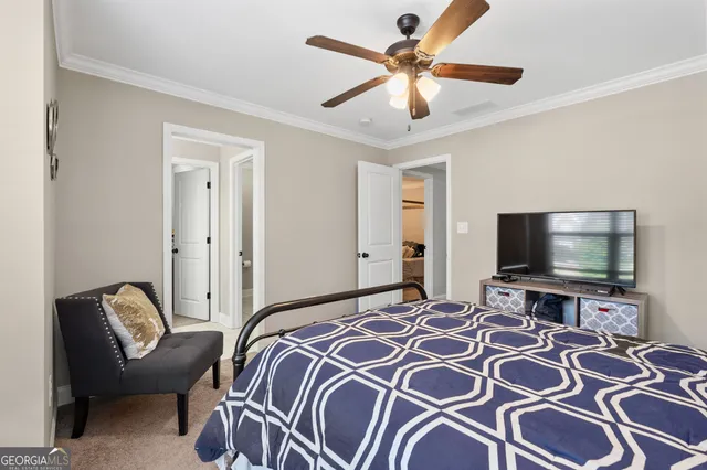 a bathroom with a granite countertop bathtub shower sink vanity and toilet