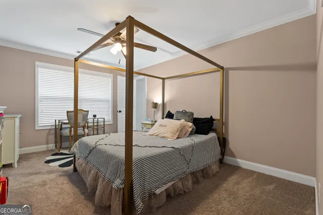 a dining room with furniture a chandelier and wooden floor