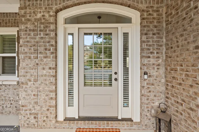 a view of a dining room with furniture and a chandelier fan