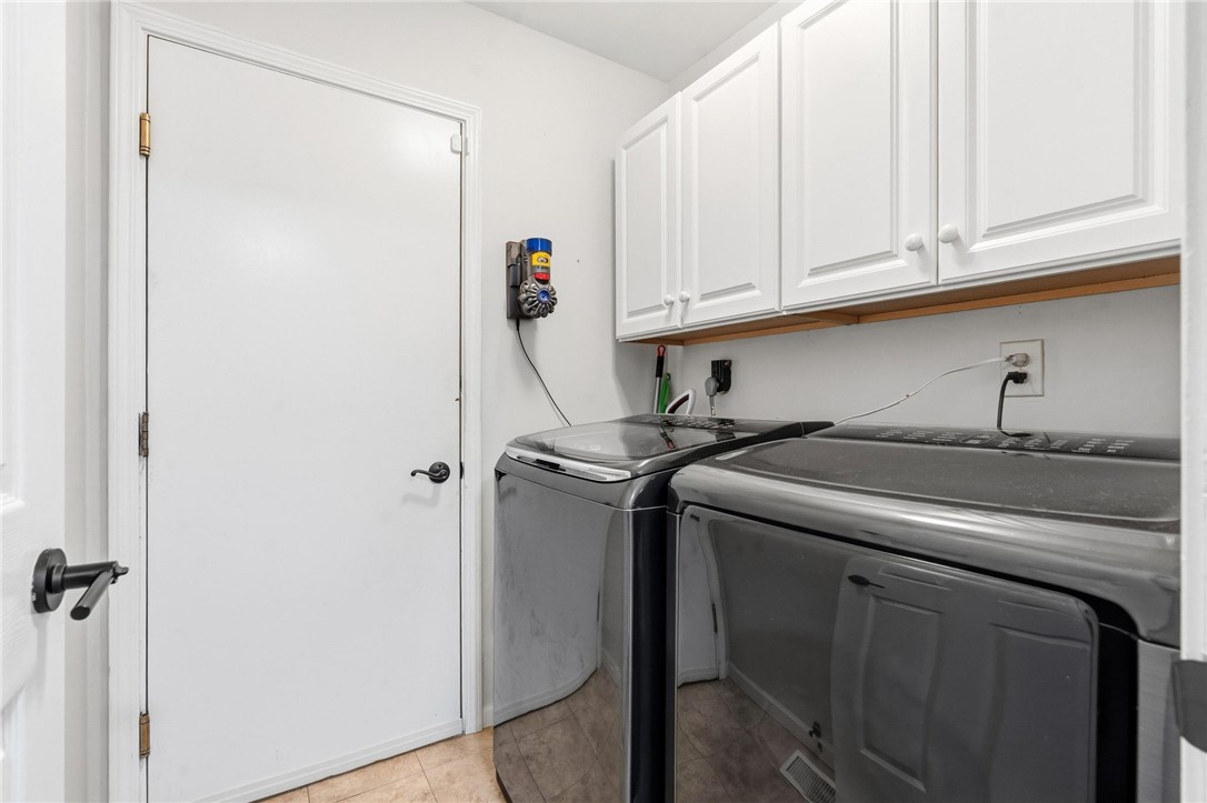 8781 Rupp Farm Drive West Chester, OH 45069 - Photo 29 of 48 This dedicated laundry space combines practicality with ample storage, simplifying daily chores.
