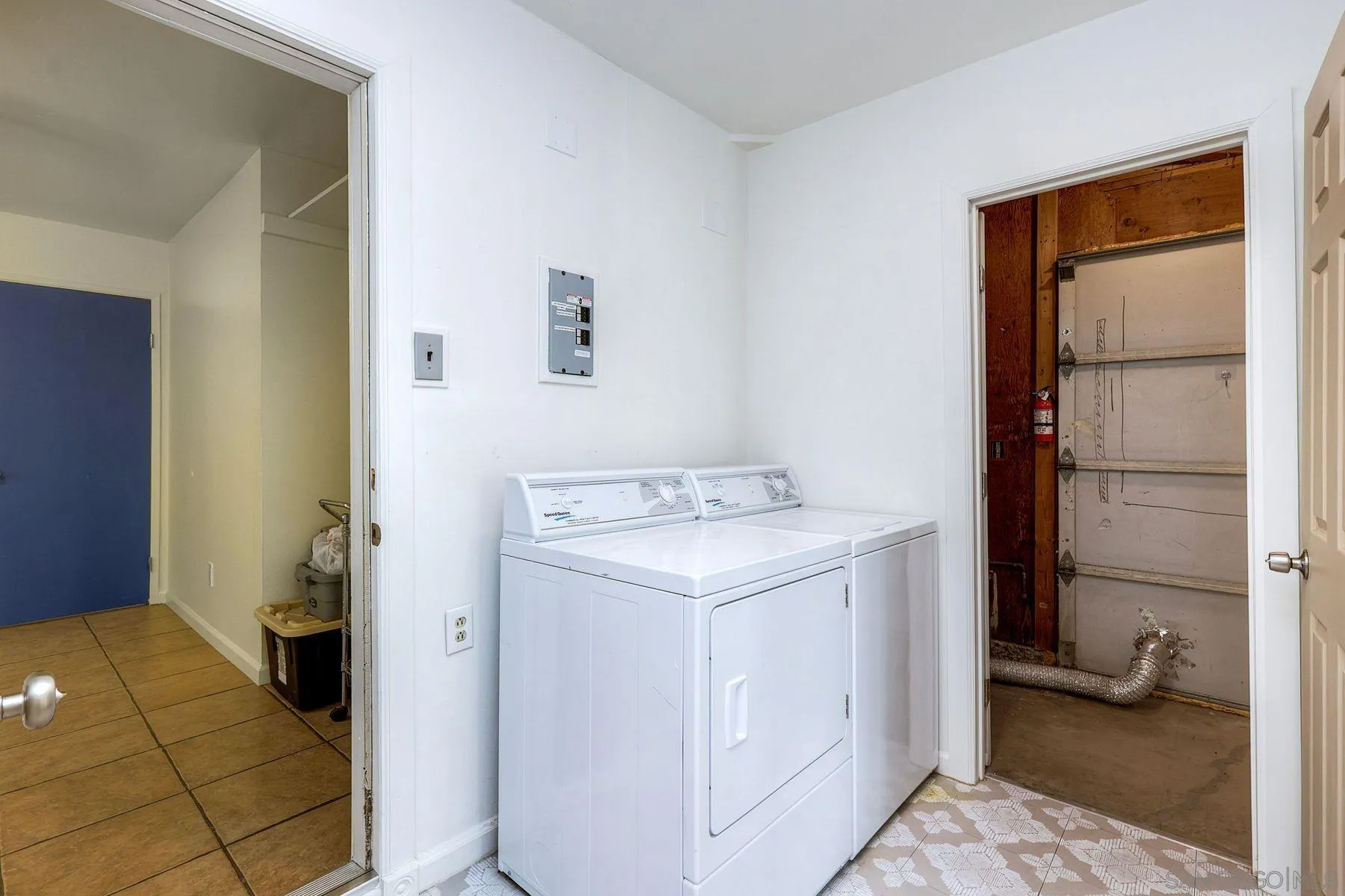 2371-75 Berry Street Lemon Grove, CA 91945 - Photo 17 of 56 a utility room with dryer and washer