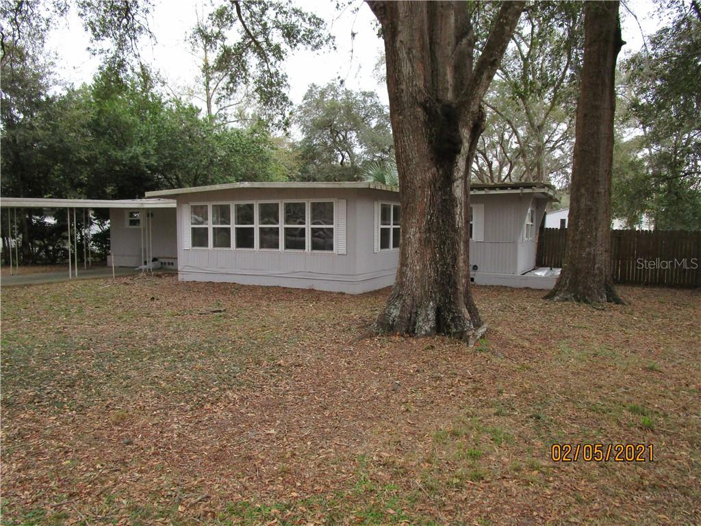 9175 Southwest 30th Court Ocala, FL 34476 - Photo 1 of 1 front view of a house with a yard