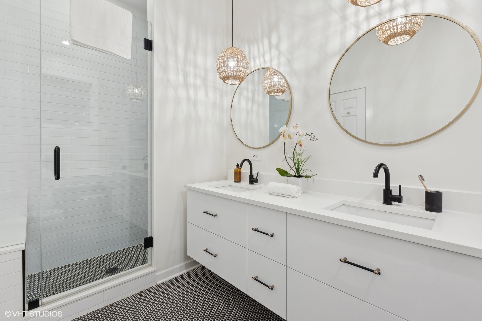 1834 West Rice Street, Unit A Chicago, IL 60622 - Photo 16 of 39 a bathroom with a double vanity sink mirror and shower