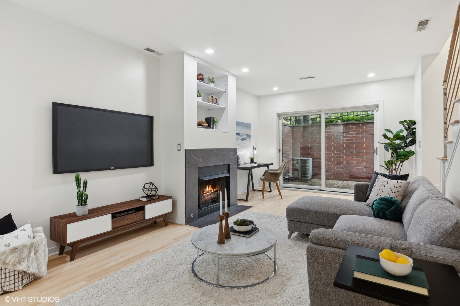 1834 West Rice Street, Unit A Chicago, IL 60622 - Photo 18 of 39 a living room with furniture and a flat screen tv