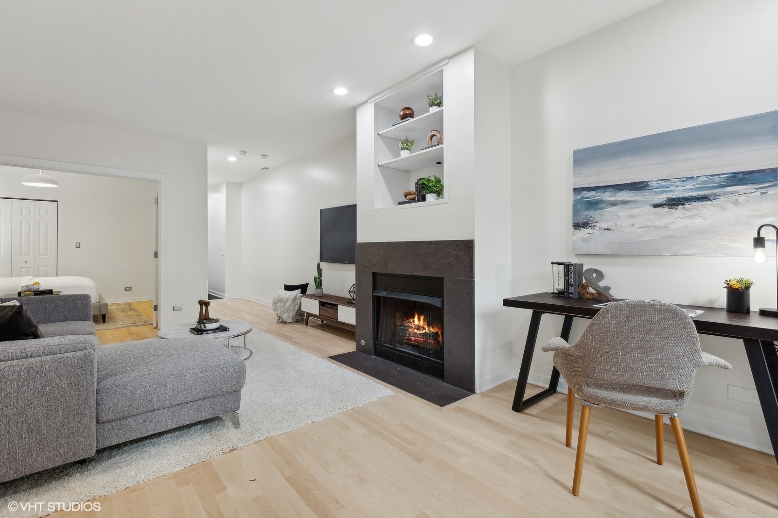 1834 West Rice Street, Unit A Chicago, IL 60622 - Photo 21 of 39 a living room with furniture and a fireplace