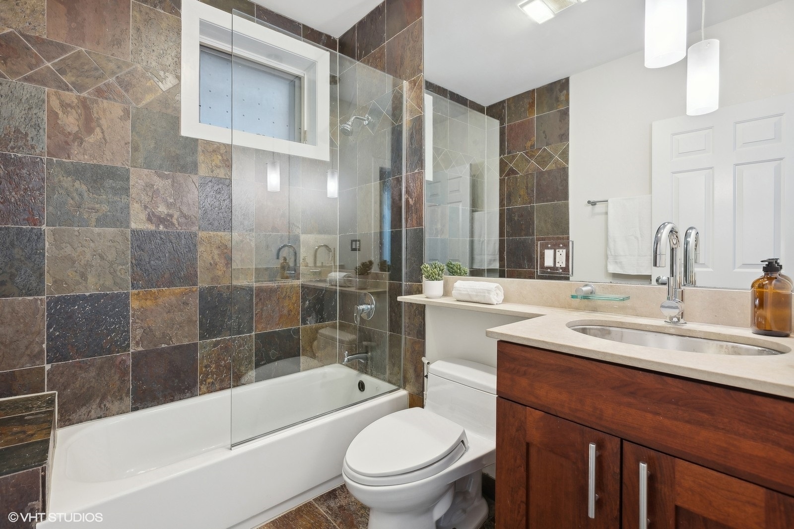 1834 West Rice Street, Unit A Chicago, IL 60622 - Photo 26 of 39 a bathroom with a sink a toilet and shower