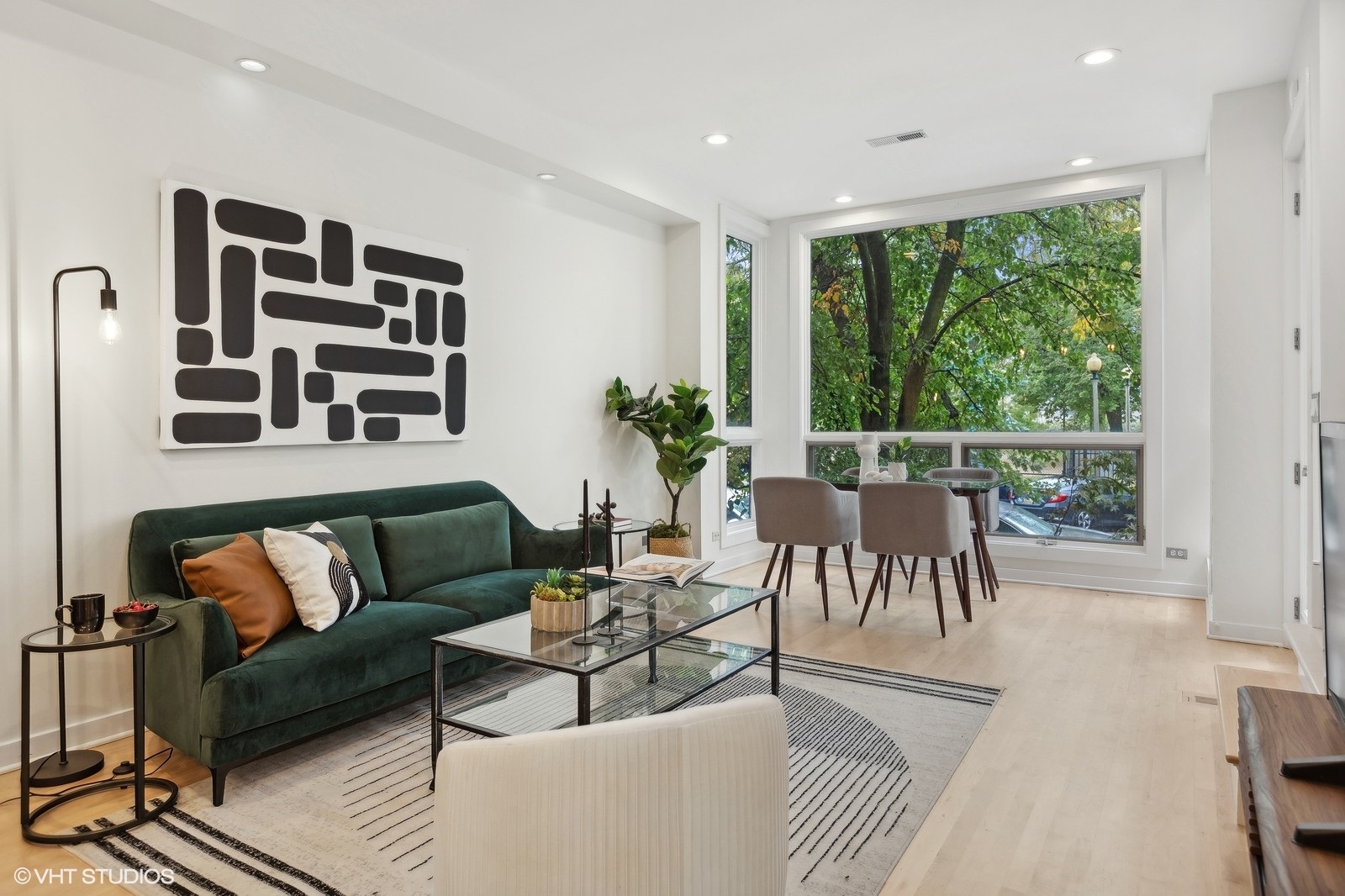 1834 West Rice Street, Unit A Chicago, IL 60622 - Photo 3 of 39 a living room with furniture and a large window