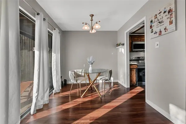 a view of a livingroom with furniture and wooden floor