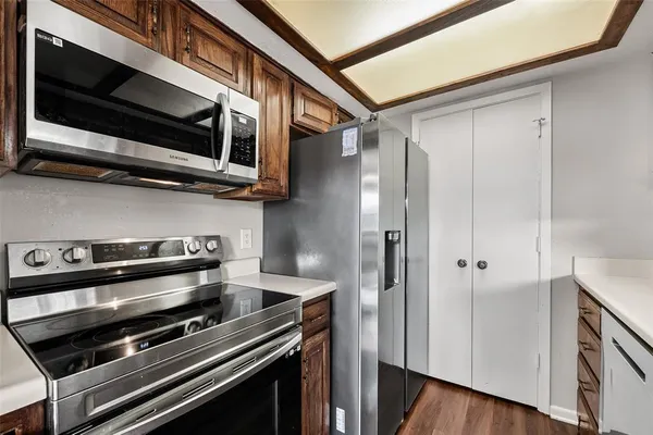 a stove top oven sitting inside of a kitchen