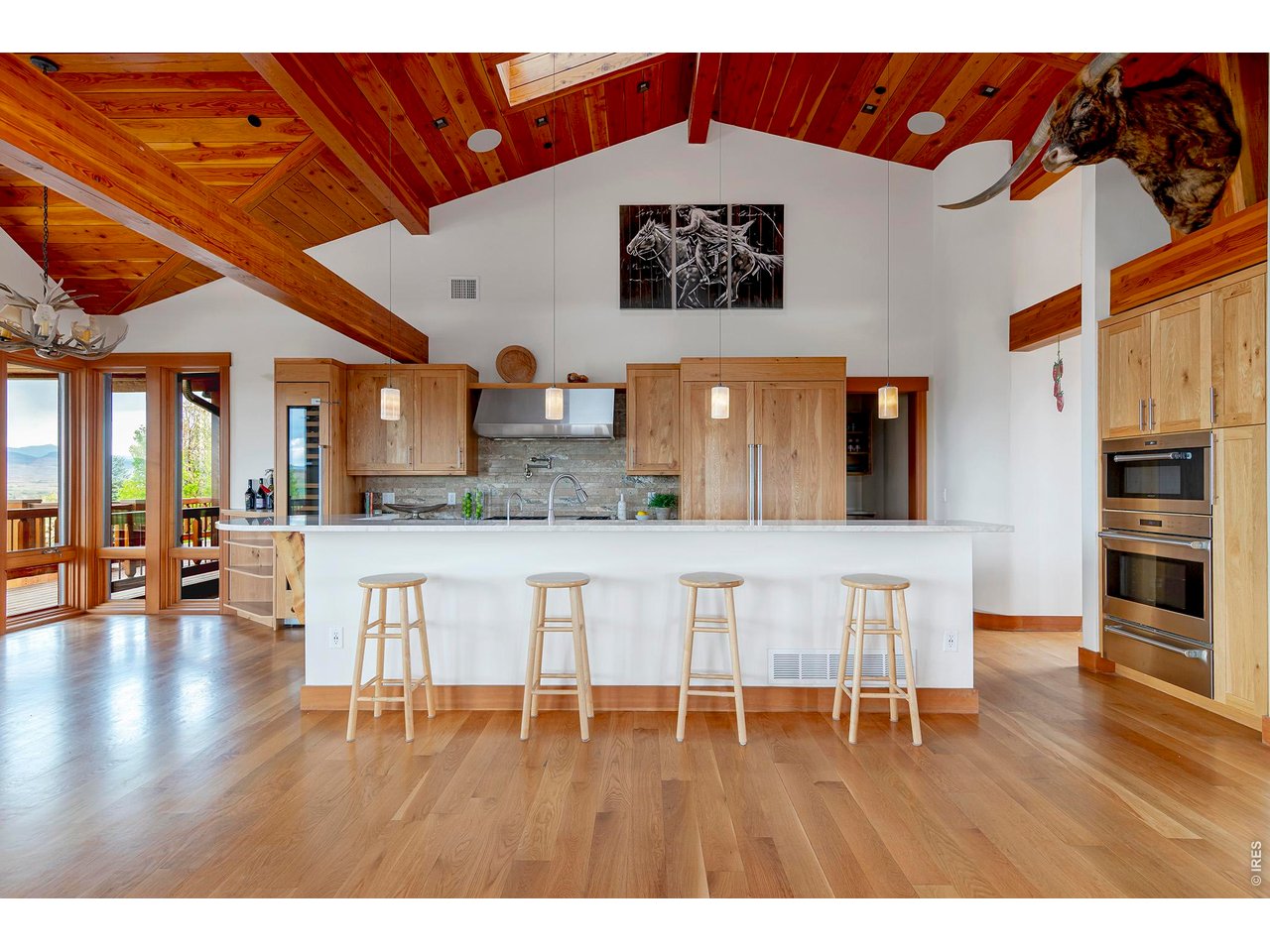 8642 Mineral Road Longmont, CO 80503 - Photo 16 of 50 a living room with furniture and wooden floor