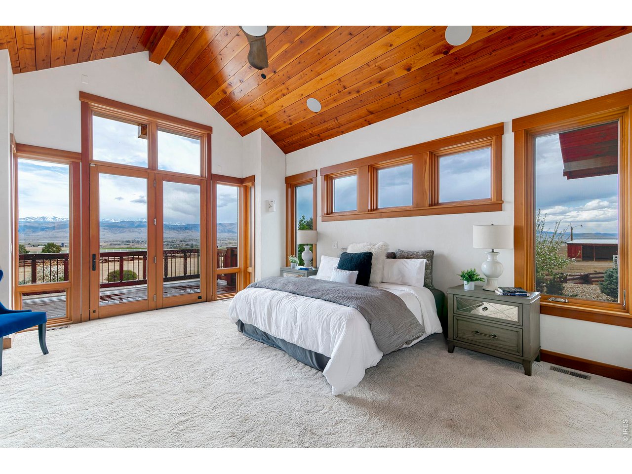 8642 Mineral Road Longmont, CO 80503 - Photo 18 of 50 a spacious bedroom with a large bed and a large window
