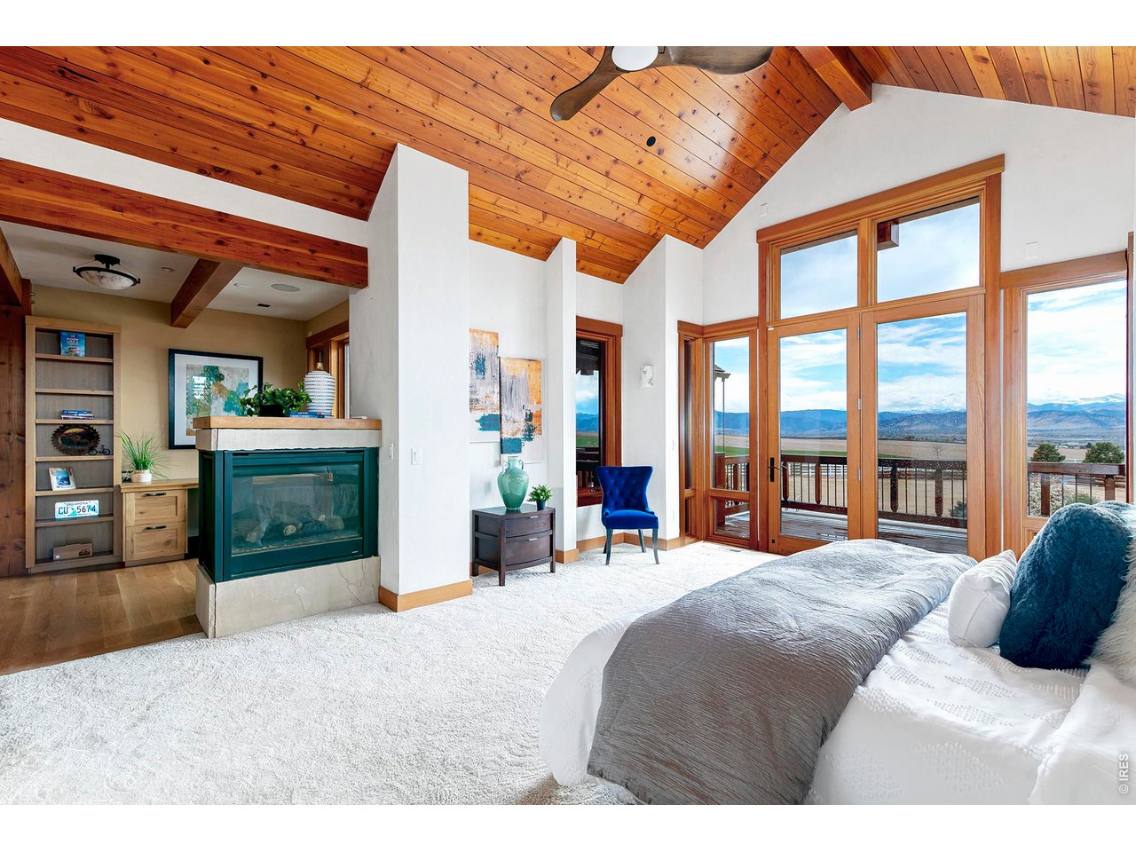 8642 Mineral Road Longmont, CO 80503 - Photo 19 of 50 a bedroom with a large bed and a large window