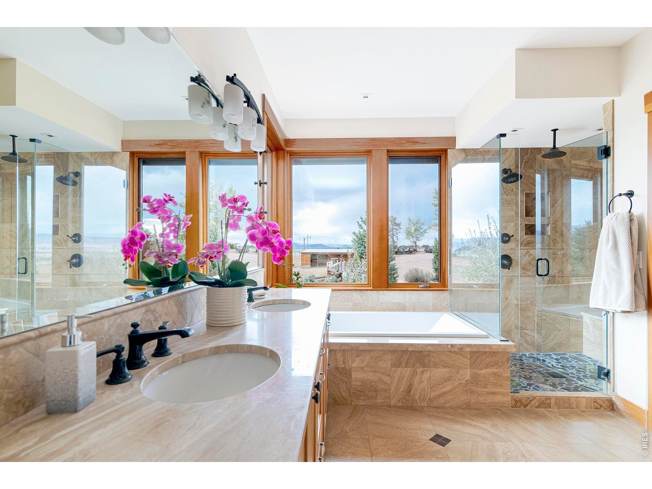 8642 Mineral Road Longmont, CO 80503 - Photo 21 of 50 a living room with painting on the wall and a dining table