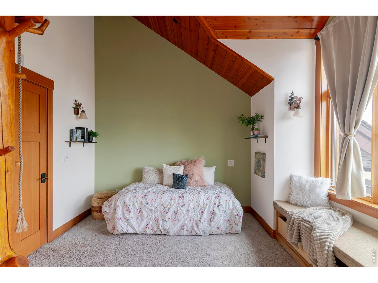 8642 Mineral Road Longmont, CO 80503 - Photo 25 of 50 a bedroom with a bed and wooden floor