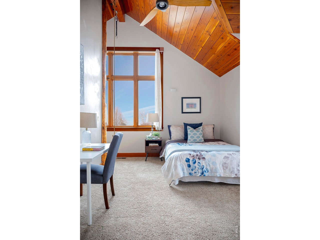 8642 Mineral Road Longmont, CO 80503 - Photo 28 of 50 a bedroom with furniture and a large window
