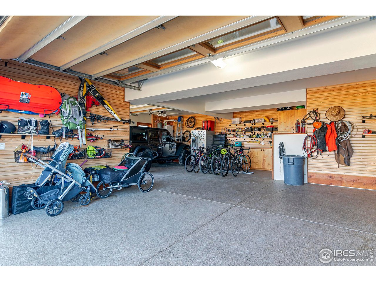 8642 Mineral Road Longmont, CO 80503 - Photo 36 of 50 a view of a garage with a bike and a table