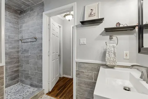 a bathroom with a sink and a mirror