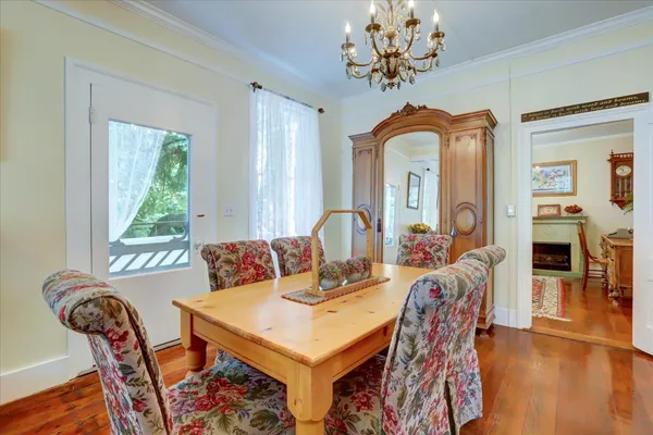 a living room with furniture a rug and a window