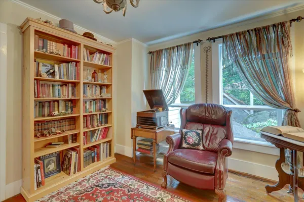 a view of a dining room with furniture window and wooden floor