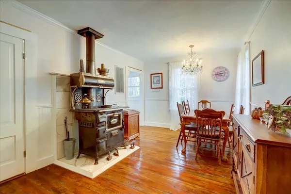 a kitchen with a sink cabinets and a window
