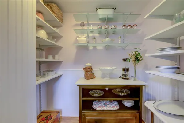 a bedroom with a bed and a desk