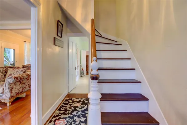 a living room with furniture and a rug