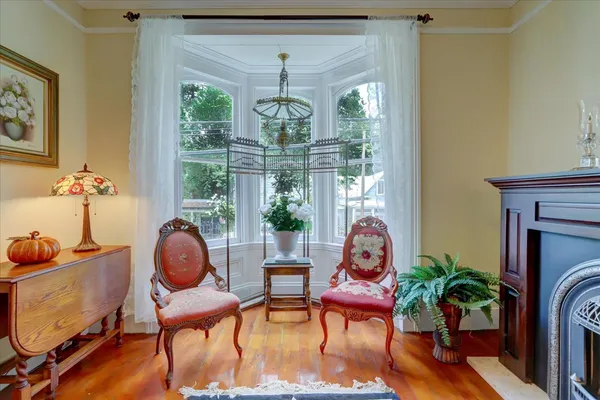 a view of a dining room with furniture window and wooden floor