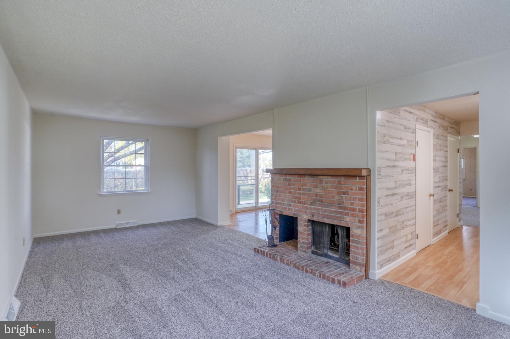 39 Duchess Circle Dover, DE 19901 - Photo 11 of 48 a view of an empty room with a fireplace and a window