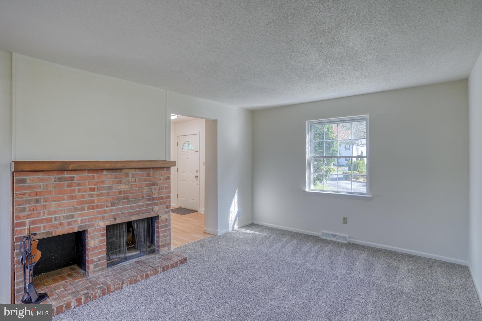 39 Duchess Circle Dover, DE 19901 - Photo 12 of 48 a living room with furniture and a fireplace