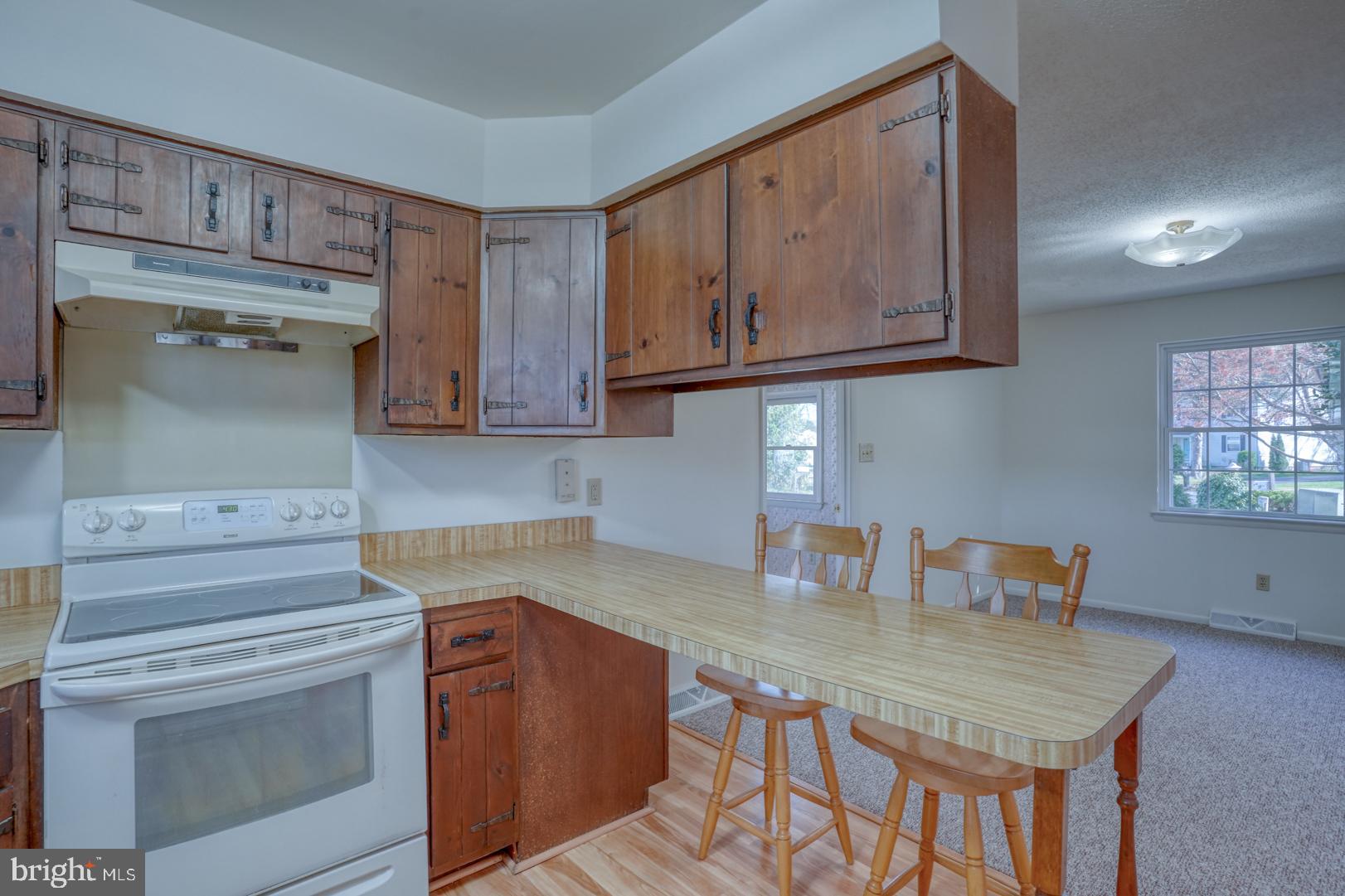 39 Duchess Circle Dover, DE 19901 - Photo 21 of 48 a kitchen with stainless steel appliances granite countertop a sink stove and cabinets