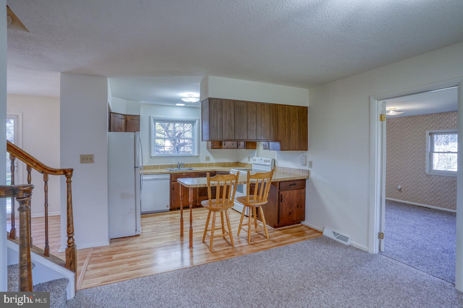 39 Duchess Circle Dover, DE 19901 - Photo 24 of 48 a kitchen with stainless steel appliances granite countertop a stove a sink and a refrigerator