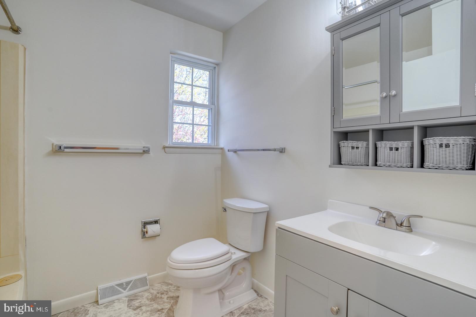 39 Duchess Circle Dover, DE 19901 - Photo 38 of 48 a bathroom with a toilet sink and mirror