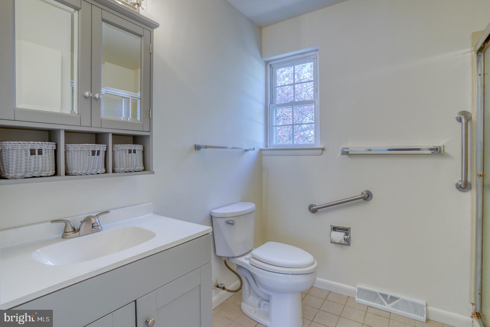 39 Duchess Circle Dover, DE 19901 - Photo 42 of 48 a bathroom with a toilet sink and mirror