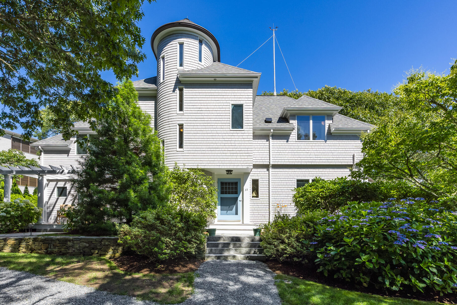 a front view of a house with garden