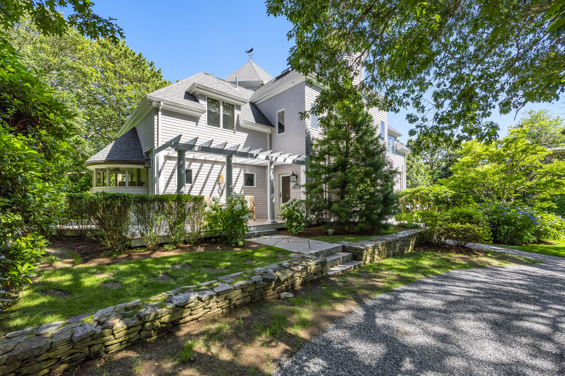 33 Pasture Road Cataumet, MA 02534 - Photo 2 of 90 a front view of a house with a yard
