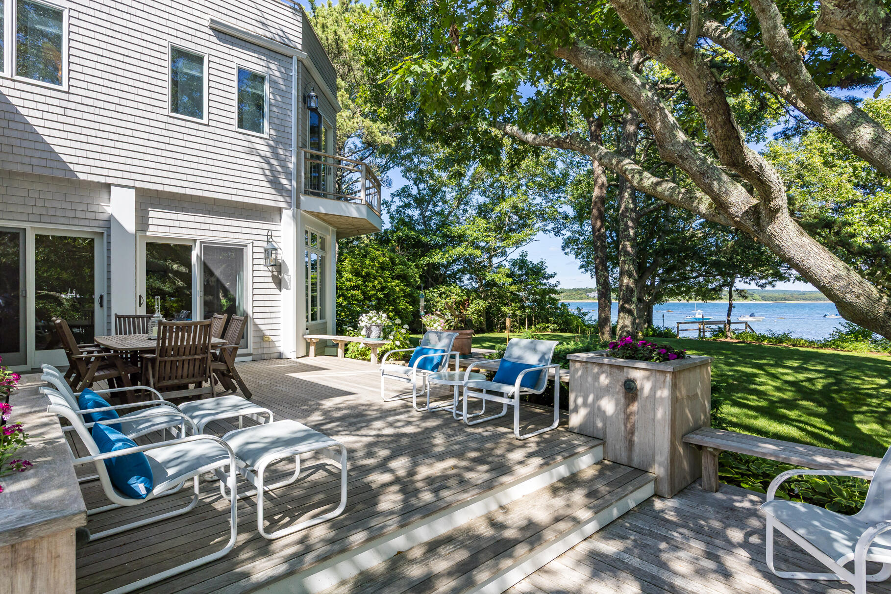 33 Pasture Road Cataumet, MA 02534 - Photo 23 of 90 a view of a patio with table and chairs and potted plants