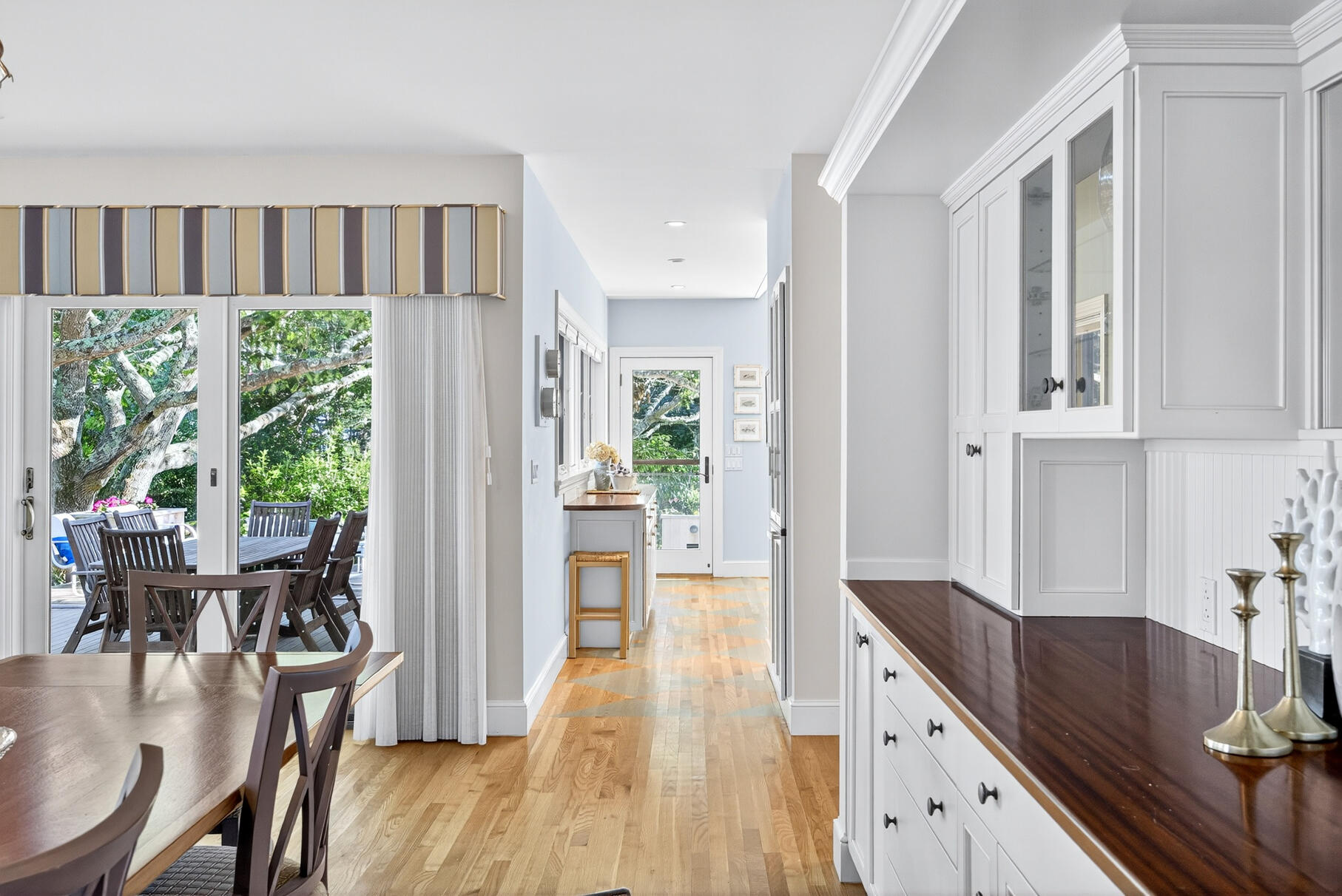 33 Pasture Road Cataumet, MA 02534 - Photo 37 of 90 a kitchen with stainless steel appliances granite countertop a refrigerator a sink dishwasher and white cabinets with wooden floor