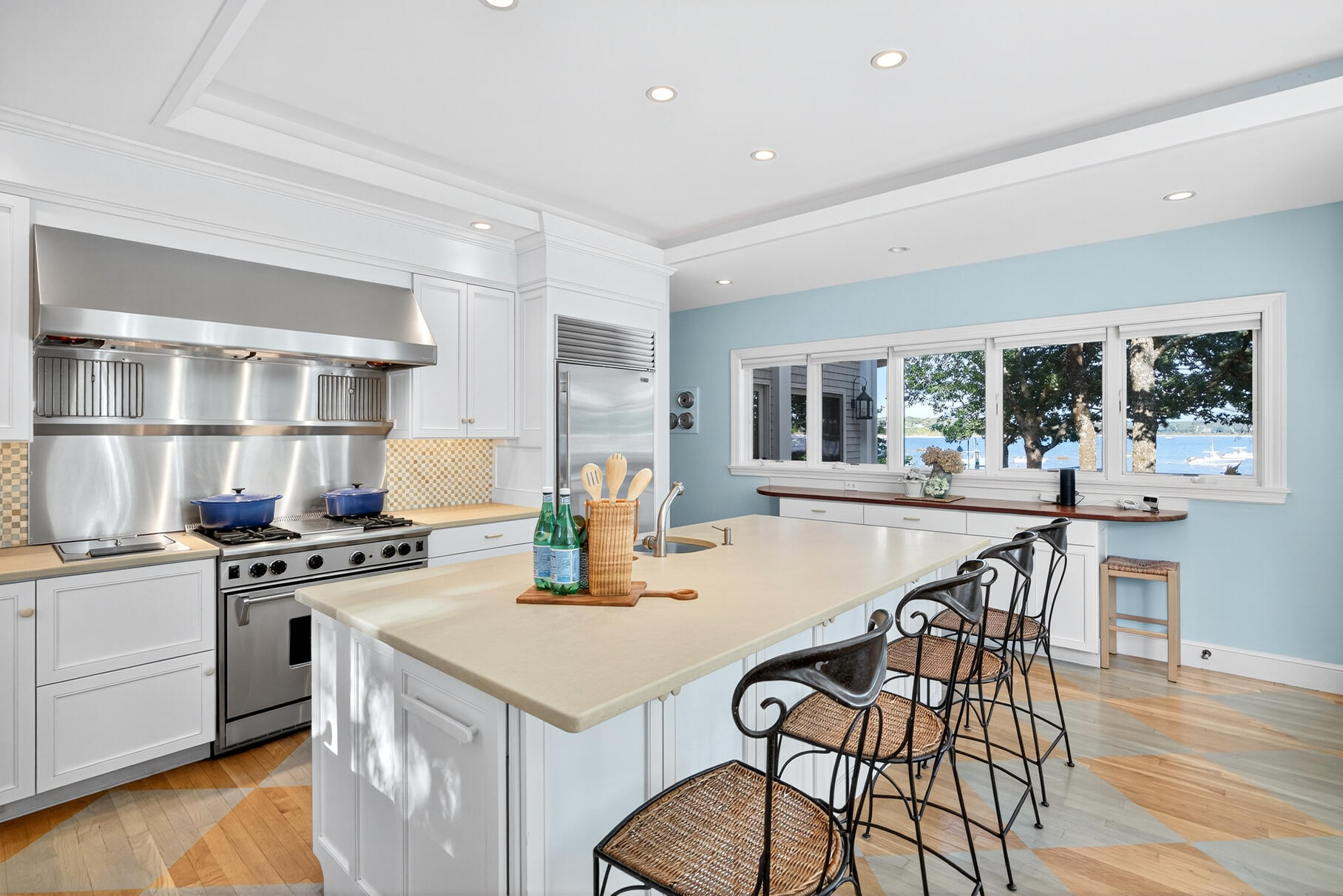 33 Pasture Road Cataumet, MA 02534 - Photo 43 of 90 a kitchen with a table chairs stove and wooden floor