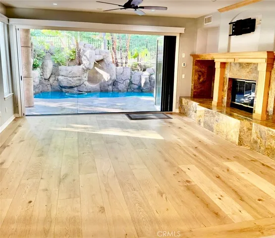 a view of living room with furniture and fireplace