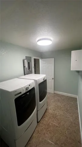 a view of backyard with large trees