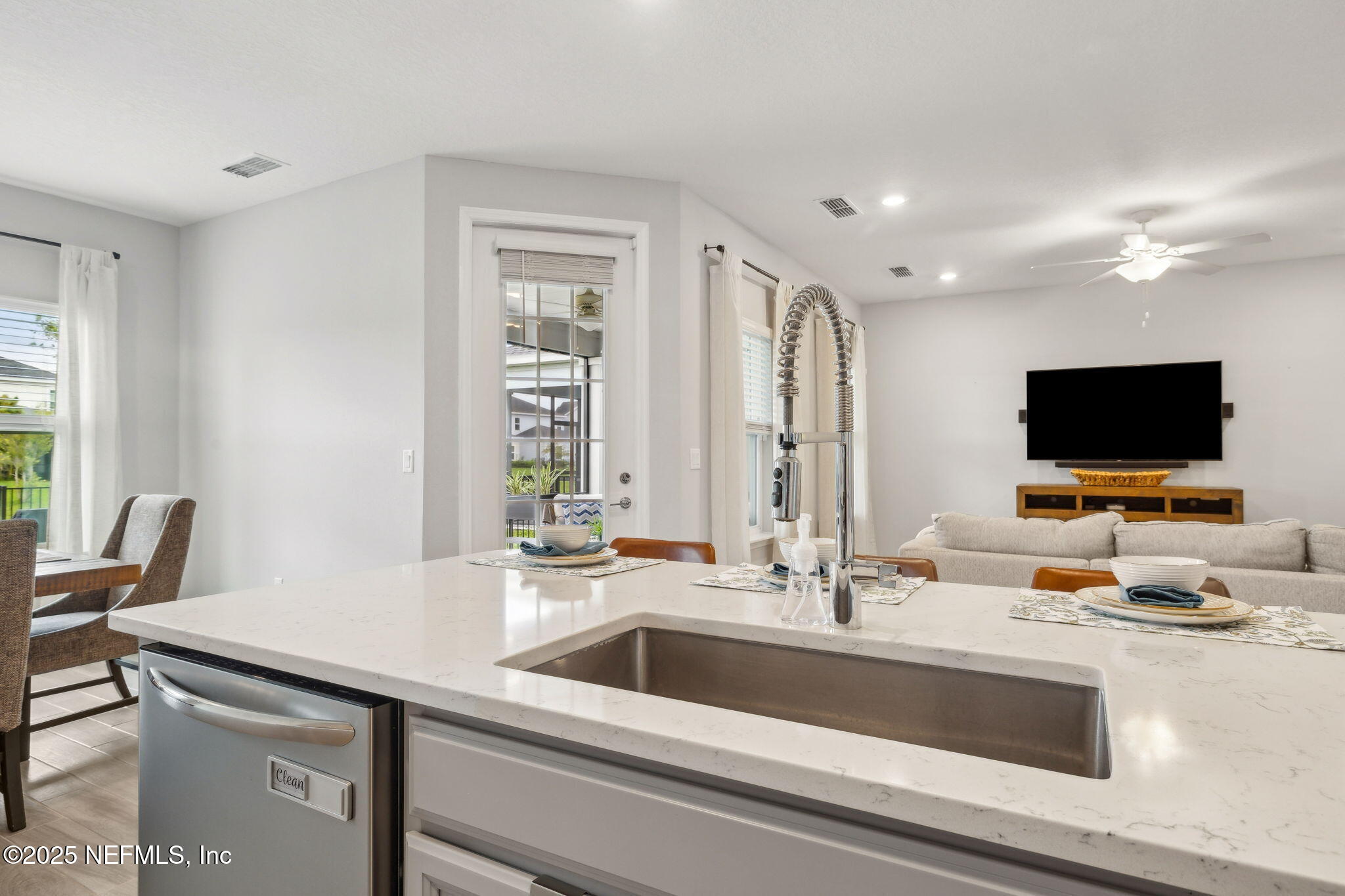 228 Killarney Avenue St. Johns, FL 32259 - Photo 13 of 64 a view of living room with granite countertop furniture and a flat screen tv