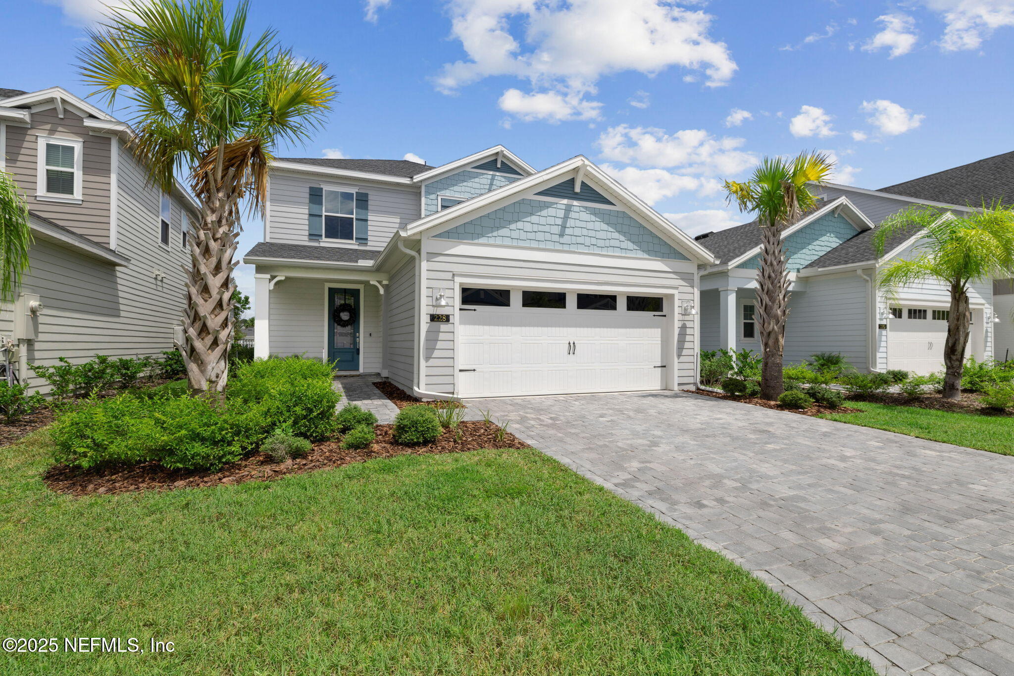 228 Killarney Avenue St. Johns, FL 32259 - Photo 2 of 64 a front view of a house with a yard and garage