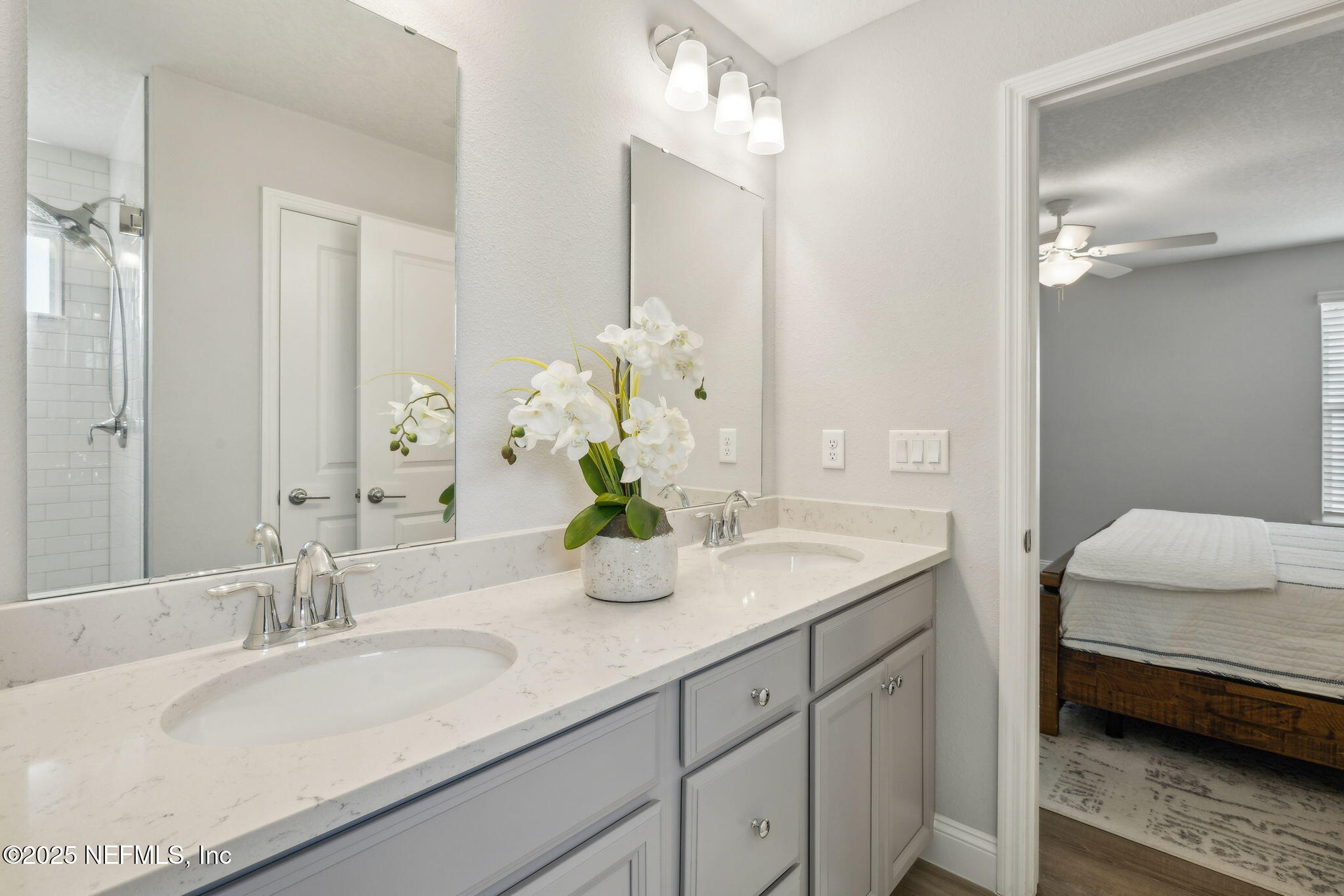 228 Killarney Avenue St. Johns, FL 32259 - Photo 24 of 64 a bathroom with a granite countertop sink and a mirror