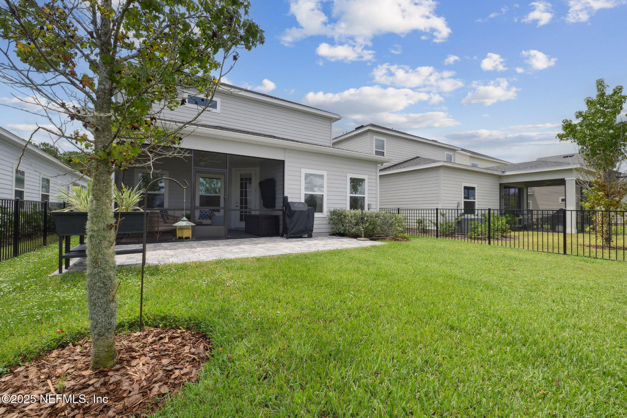 228 Killarney Avenue St. Johns, FL 32259 - Photo 38 of 64 a backyard of a house with table and chairs