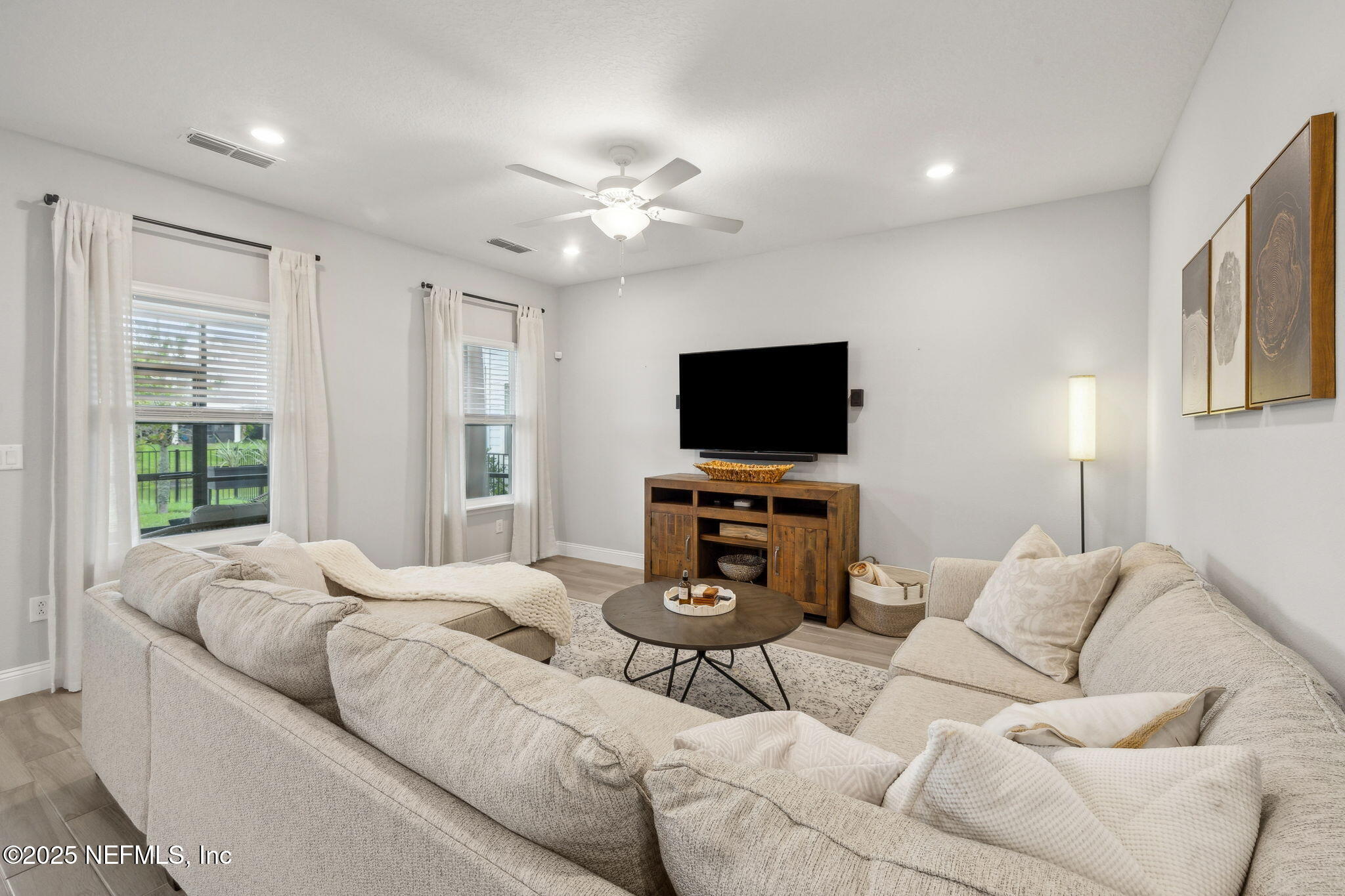 228 Killarney Avenue St. Johns, FL 32259 - Photo 9 of 64 a bedroom with furniture a flat screen tv and a window