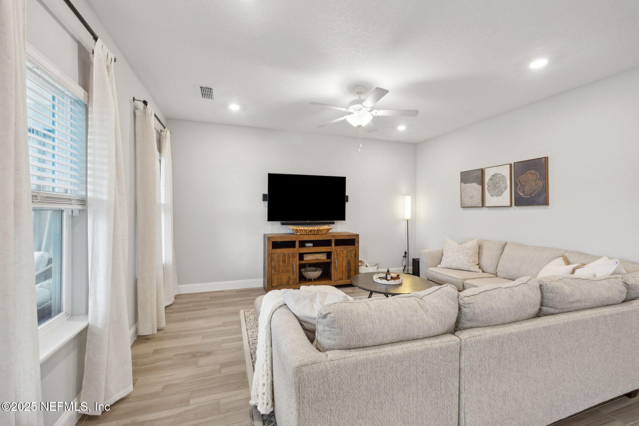 228 Killarney Avenue St. Johns, FL 32259 - Photo 10 of 64 a living room with furniture and a flat screen tv