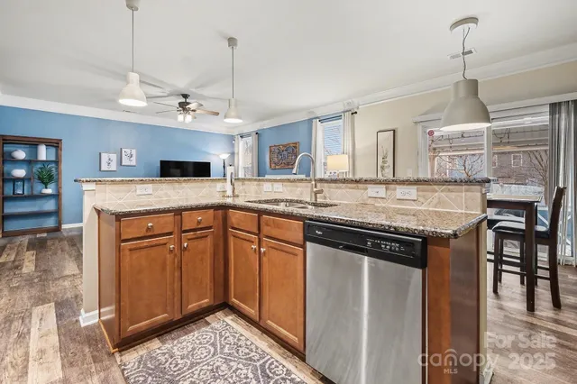 a kitchen with a stove a sink and a refrigerator