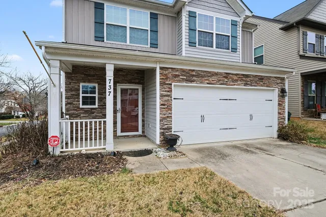 a front view of a house with a garage