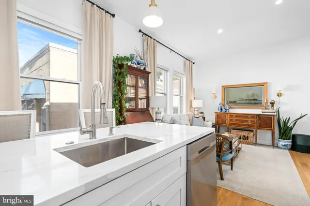 a living room with furniture fireplace and flat screen tv
